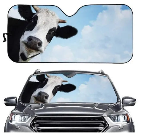 Telescopic aluminium foil car sun shield extended across a vehicle windscreen