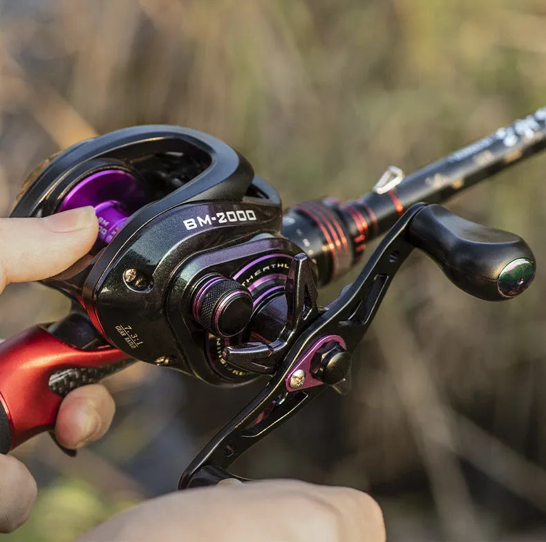 BM2000 left-handed and right-handed spinning fishing reel with magnetic brake, graphite body, and aluminium spool.