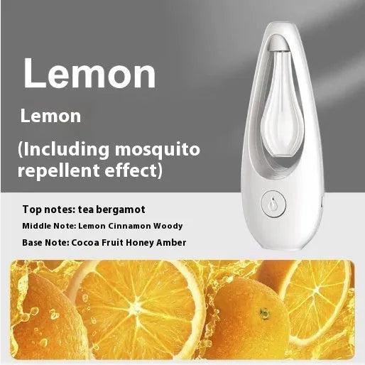 White ultrasonic aroma diffuser with control buttons and mist output, shown with essential oil bottle