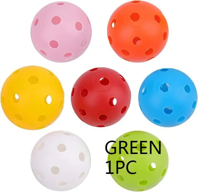 Multi-coloured golf practice balls in net storage pocket for putting training