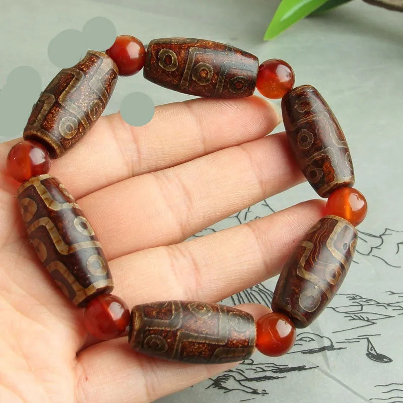 Distressed agate Tibet beads bracelet with three eye dzi design and polished stone beads