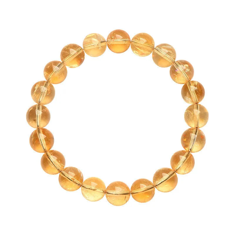 Natural yellow citrine gemstone bracelet with geometric beads on a white background.