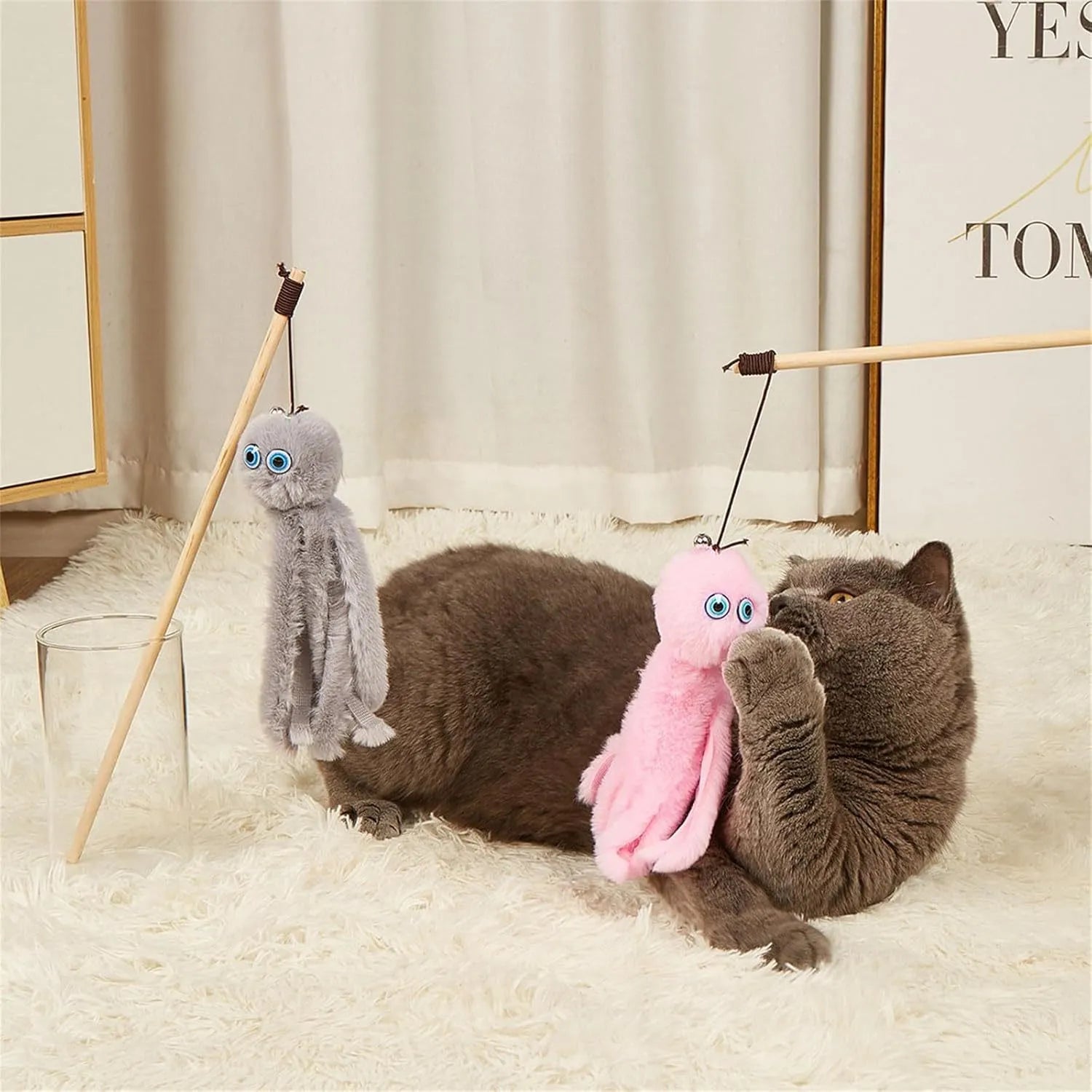 Colourful octopus cat toy with eyes on a long stick for interactive indoor play with kittens and cats
