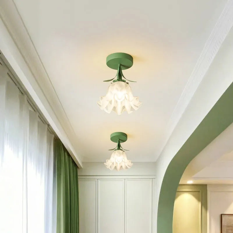 Cream coloured modern LED corridor wall light with remote control for three-colour changing and dimming.
