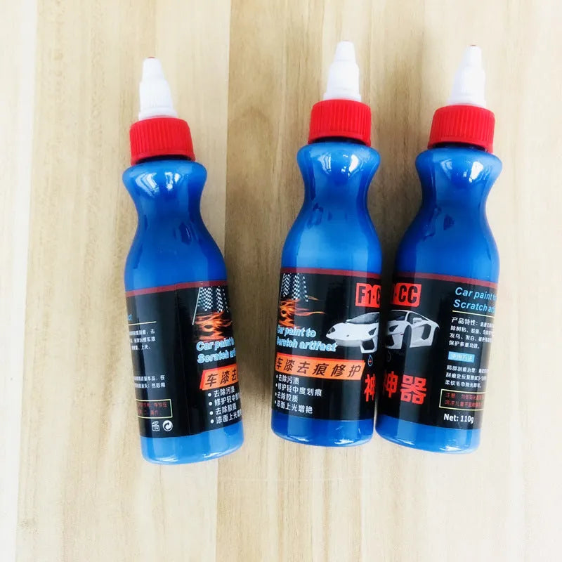 Small blue car scratch repair agent bottle with application tool for automobile bodywork