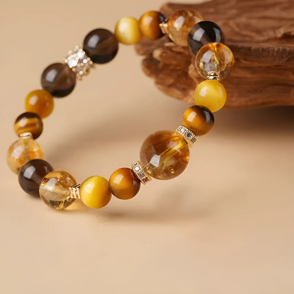 Lucky Jinba natural yellow tiger-eye crystal bracelet with geometric beads, shown in 10MM and 12MM size options.