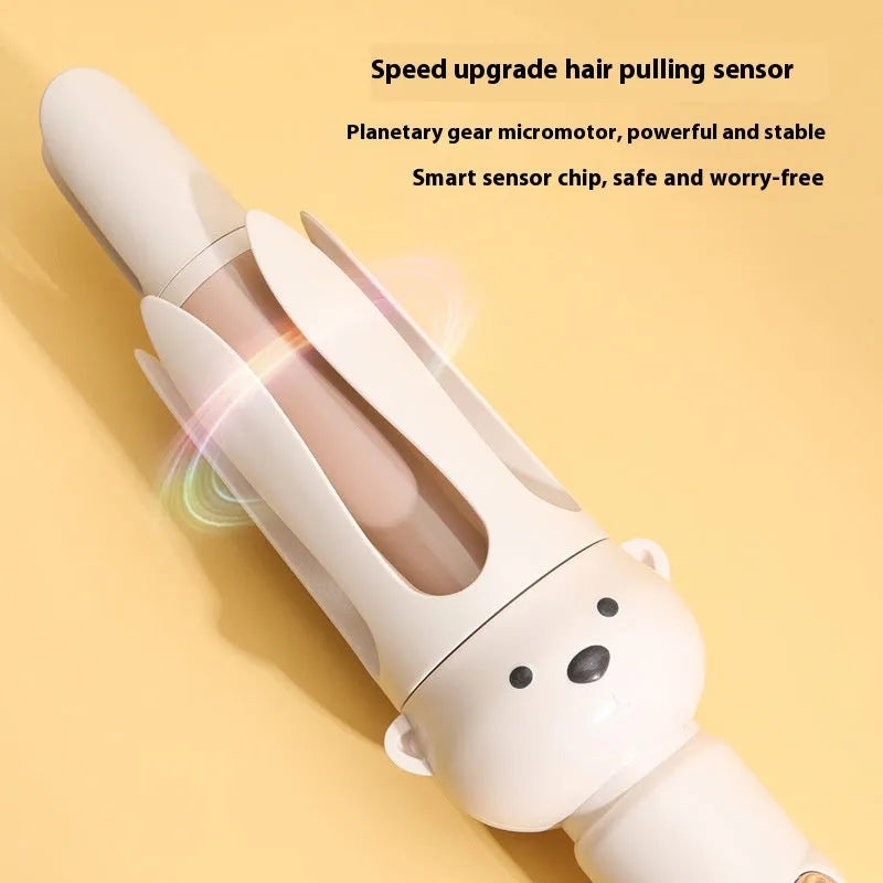 Beige anion automatic hair curler with hair stick on a white background