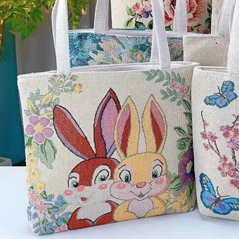 Double-sided gold wire embroidered handheld canvas tote bag in a choice of seven patterns and three sizes.