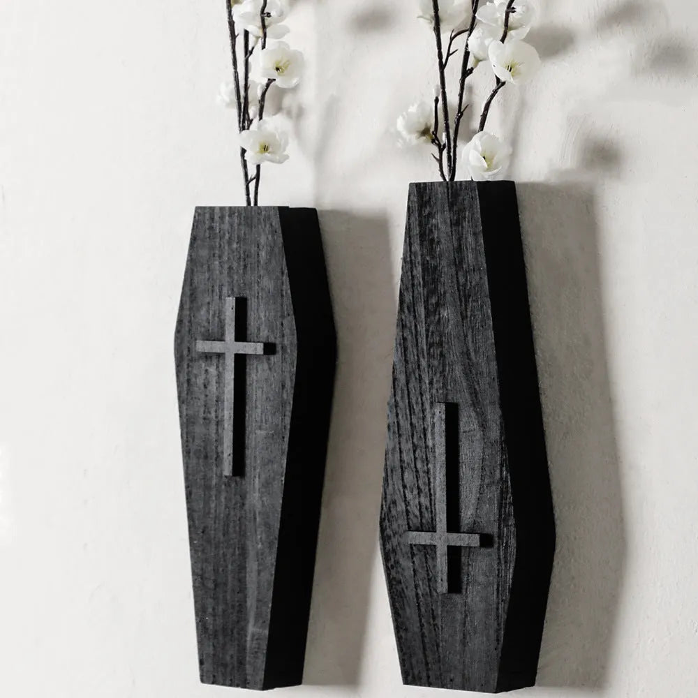 Wooden cross-shaped wall shelf decoration in black colour measuring 27 cm wide