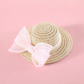 Woven straw pet hat with pearl bow decoration in pink, purple, blue or white colour options