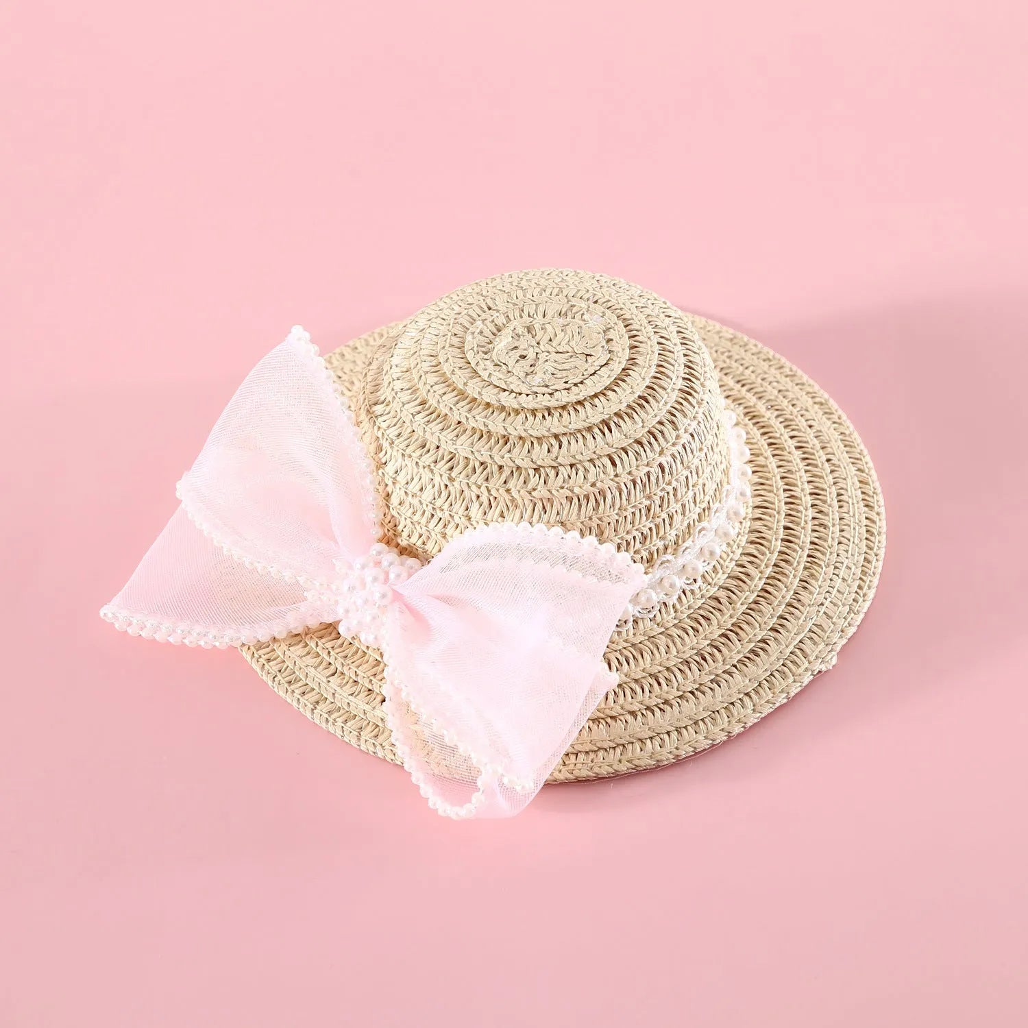 Woven straw pet hat with pearl bow decoration in pink, purple, blue or white colour options