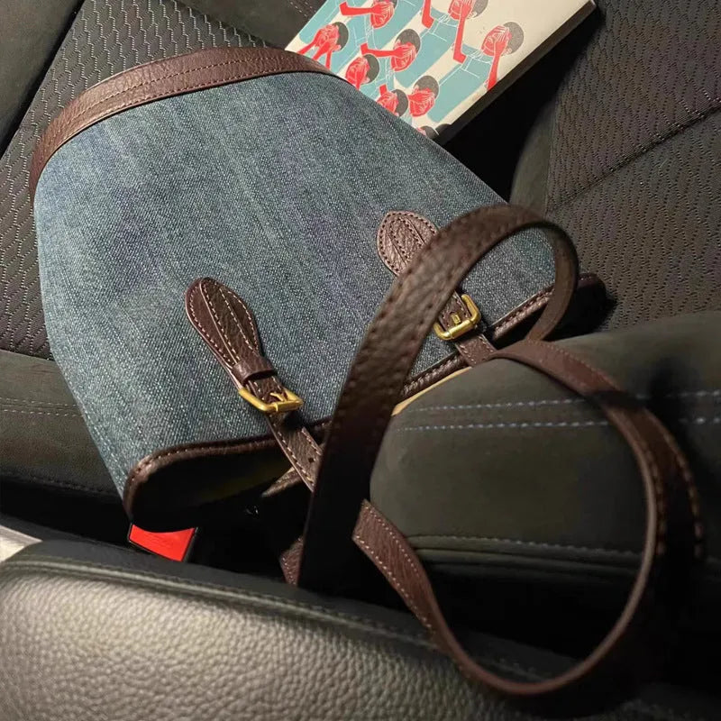 Denim patchwork bucket handbag showing patchwork detailing and one-shoulder strap