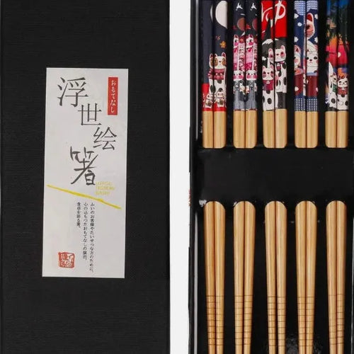 Set of five pairs of bamboo chopsticks with Japanese lucky cat pattern in a gift box.