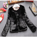 Women's short faux fur crop top in beige with regular sleeves on a hanger.