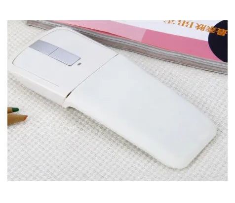 Folded Bluetooth wireless mouse showing compact 131.2mm length with touch-sensitive surface