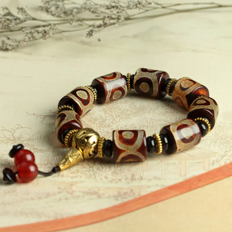 Distressed agate Tibet beads bracelet with three eye dzi design and polished stone beads