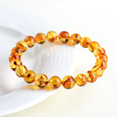 Natural yellow piebald amber bracelet with geometric beads for water purification