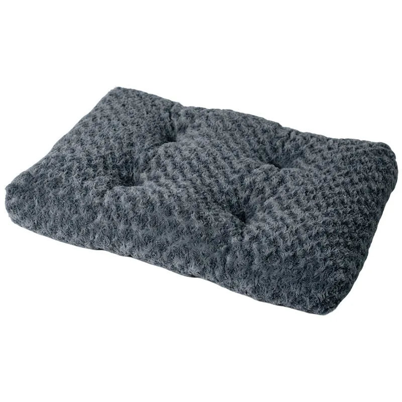 Embossed velvet thick square pet mat for dogs in dark gray on a floor with a dog resting on it