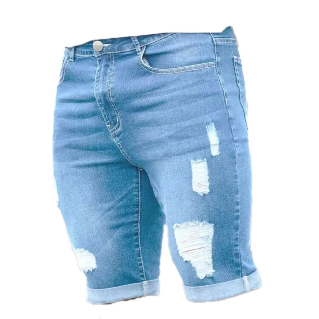 Sky blue men's denim shorts with distressed multi-hole detailing and low waist design