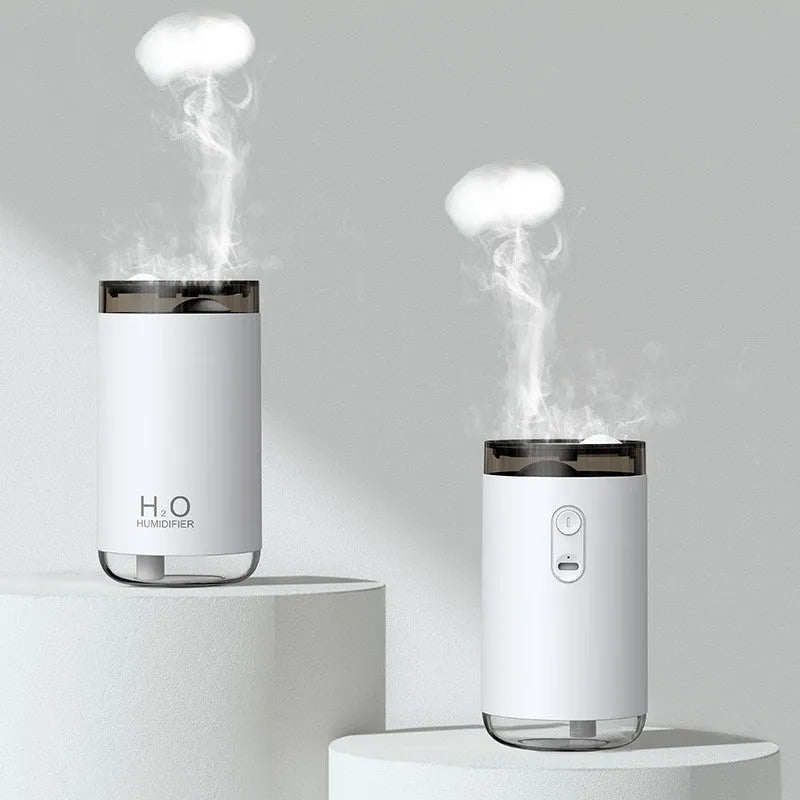 White jellyfish smoke ring humidifier with warm night light on a wooden surface
