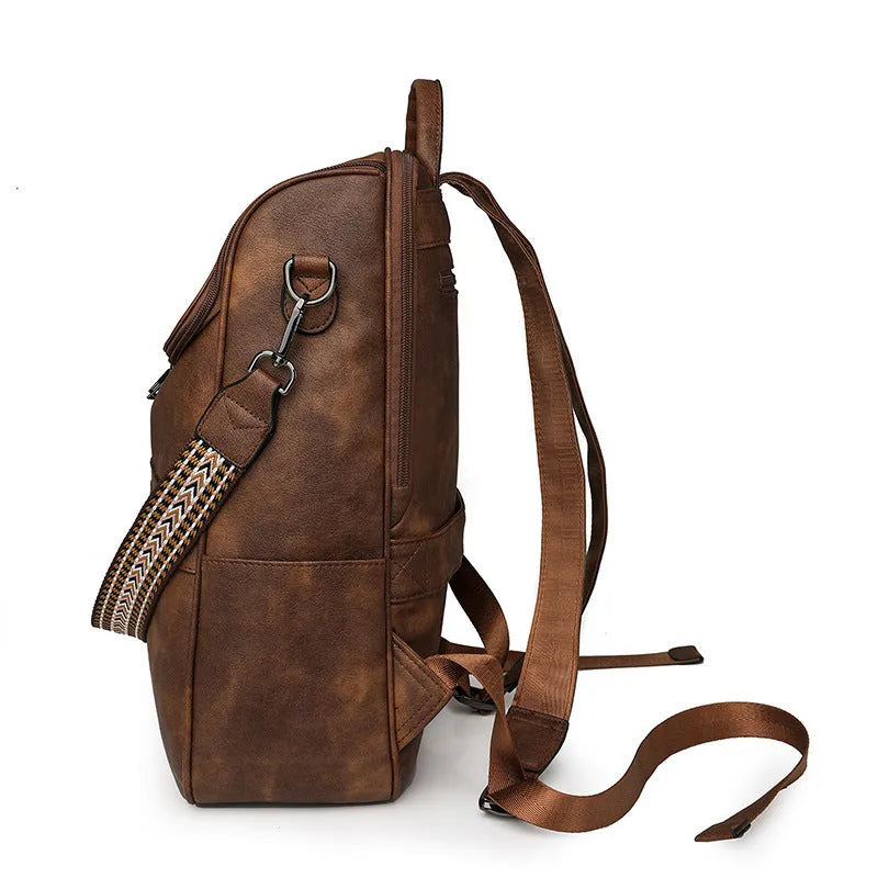 Retro college style PU backpack with curved shoulder straps shown in a solid colour with stitching detail.