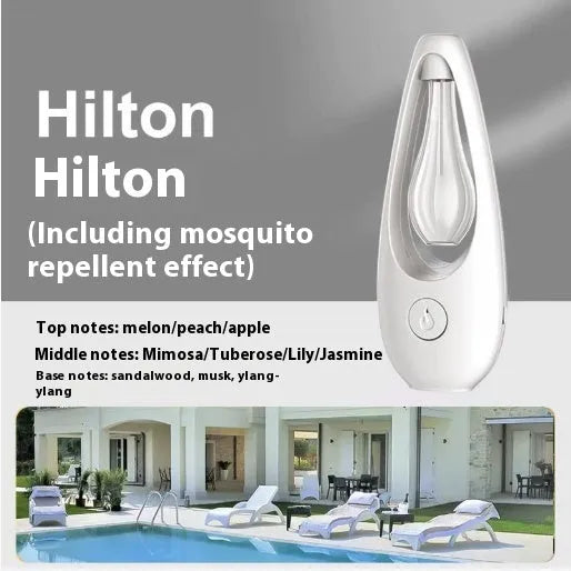 White ultrasonic aroma diffuser with control buttons and mist output, shown with essential oil bottle