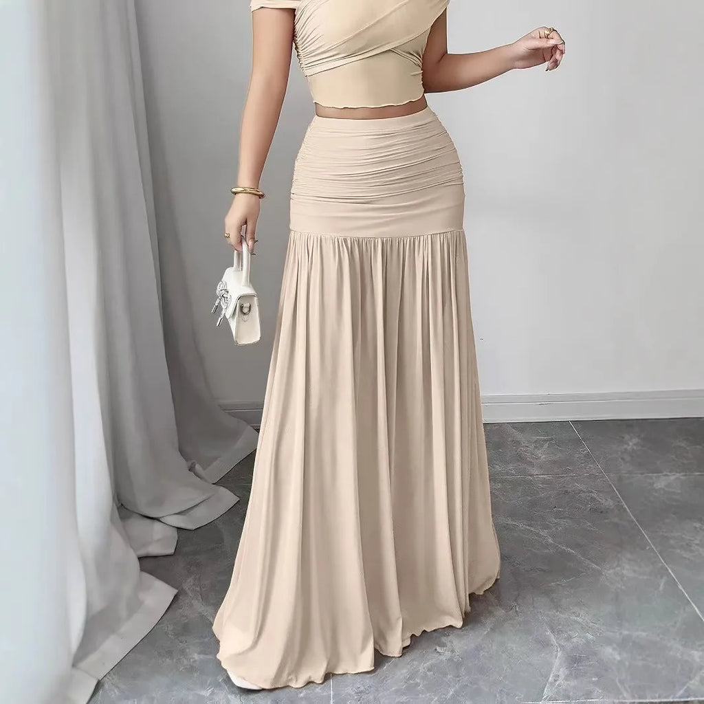 Women's pleated long skirt in polyester fibre, pink colour, with medium stretch and irregular hem, side view