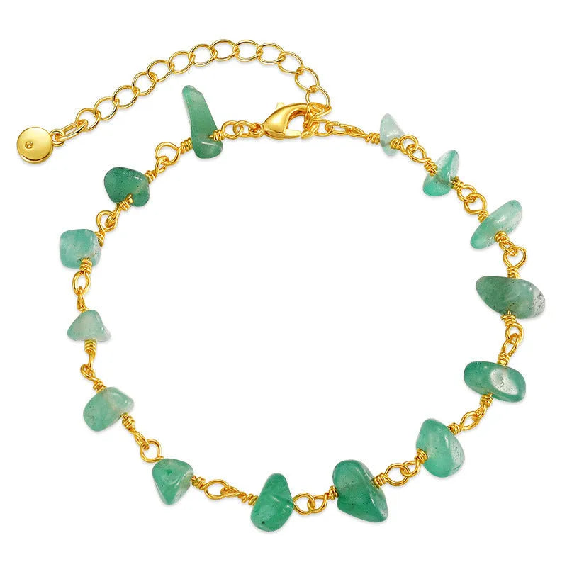 Geometric women's bracelet with irregular turquoise stones and crystal details on 18K copper