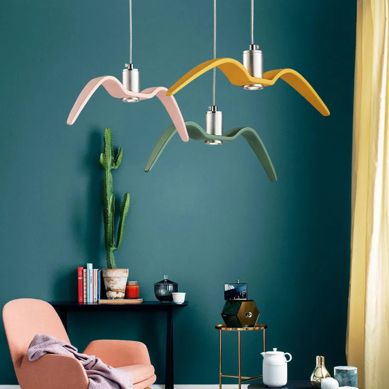 Nordic modern macaron-shaped LED chandelier light fitting in multiple colour options.