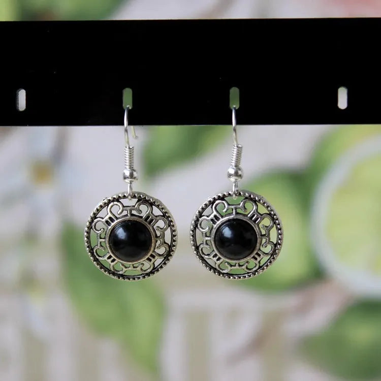 Handmade Tibetan silver earrings with turquoise geometric flower disk design in Miao ethnic style