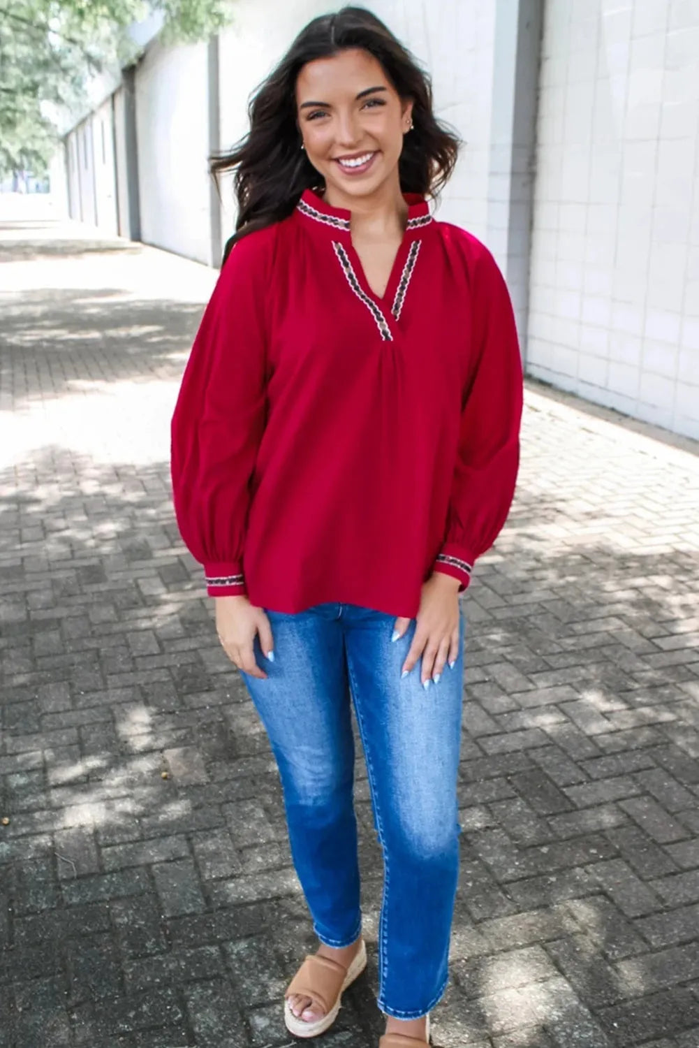 Women's red polyester pullover shirt with embroidered collar and printed design, loose fit