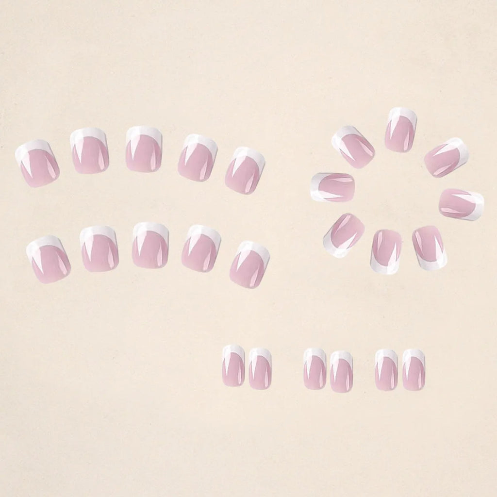 White fake nails with black and white plaid pattern, 24 pieces in an open box.