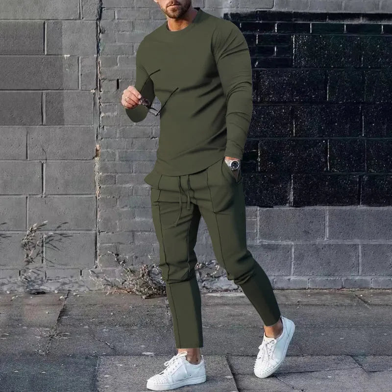 Men's light grey two-piece suit set with long sleeve round neck t-shirt and matching trousers.