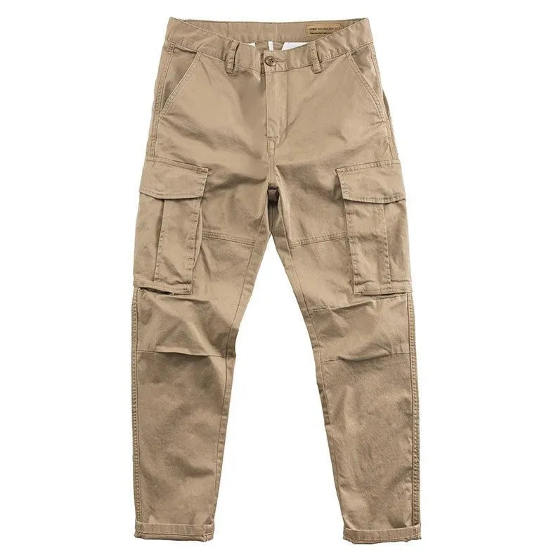 Men's solid colour cotton trousers with multiple pockets in a cropped length, shown in khaki, grey, black, and blue.