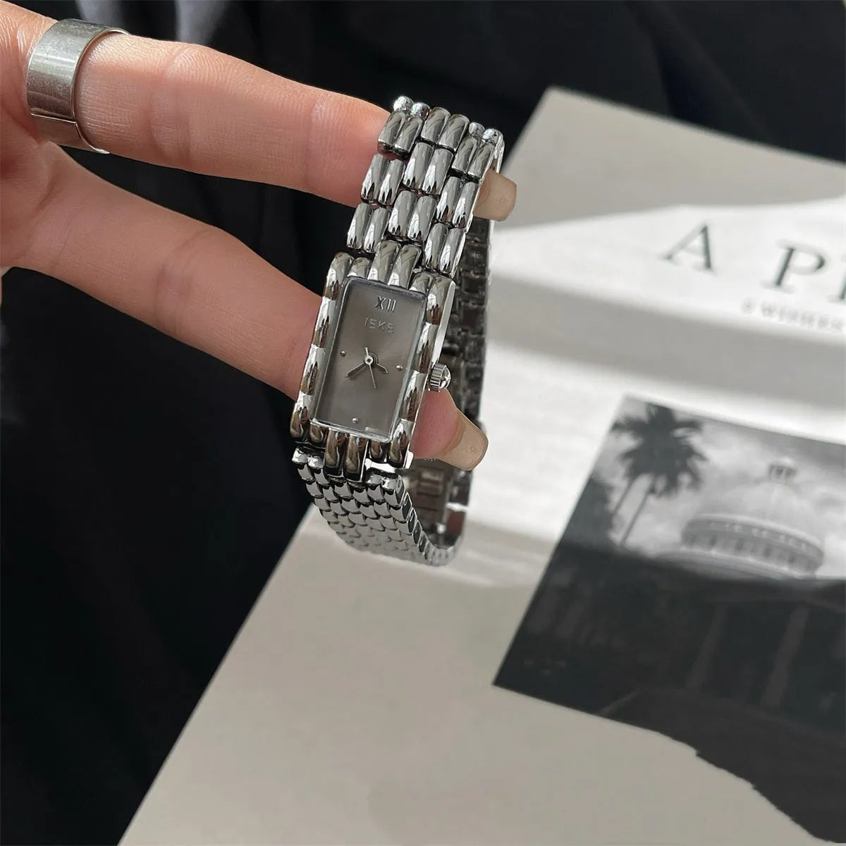 Women's mid-century bracelet watch with a 15mm dial, stainless steel case, and butterfly clasp in silver and gold colour options.