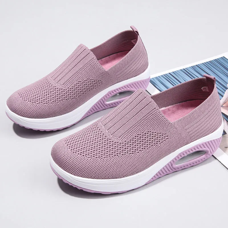 Women's mesh running shoes with air cushion in multiple colours showing round toe and mid-heel design