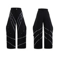 Men's black trousers with a deconstructing three-dimensional cut and pleats secured with metal striped rivets.