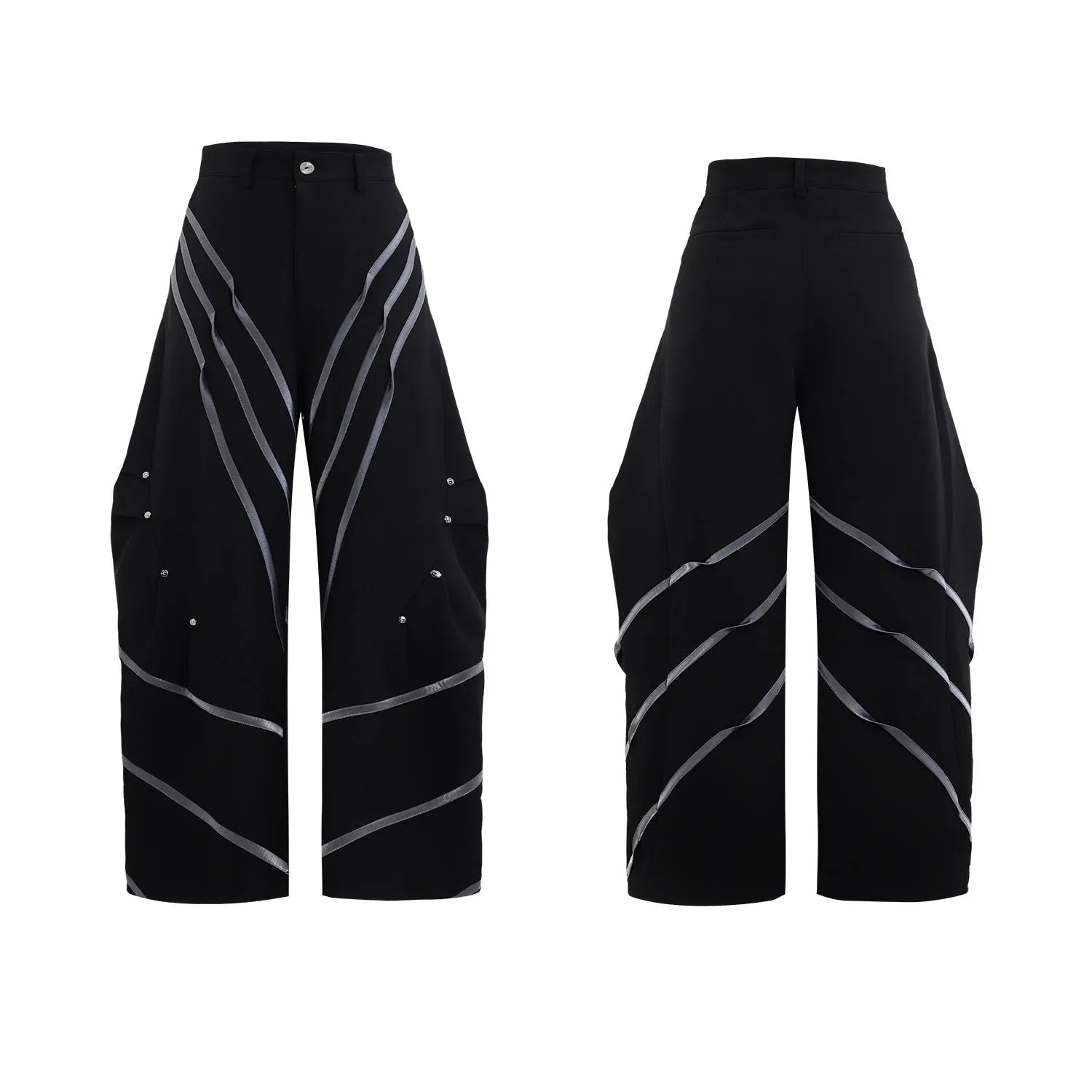 Men's black trousers with a deconstructing three-dimensional cut and pleats secured with metal striped rivets.