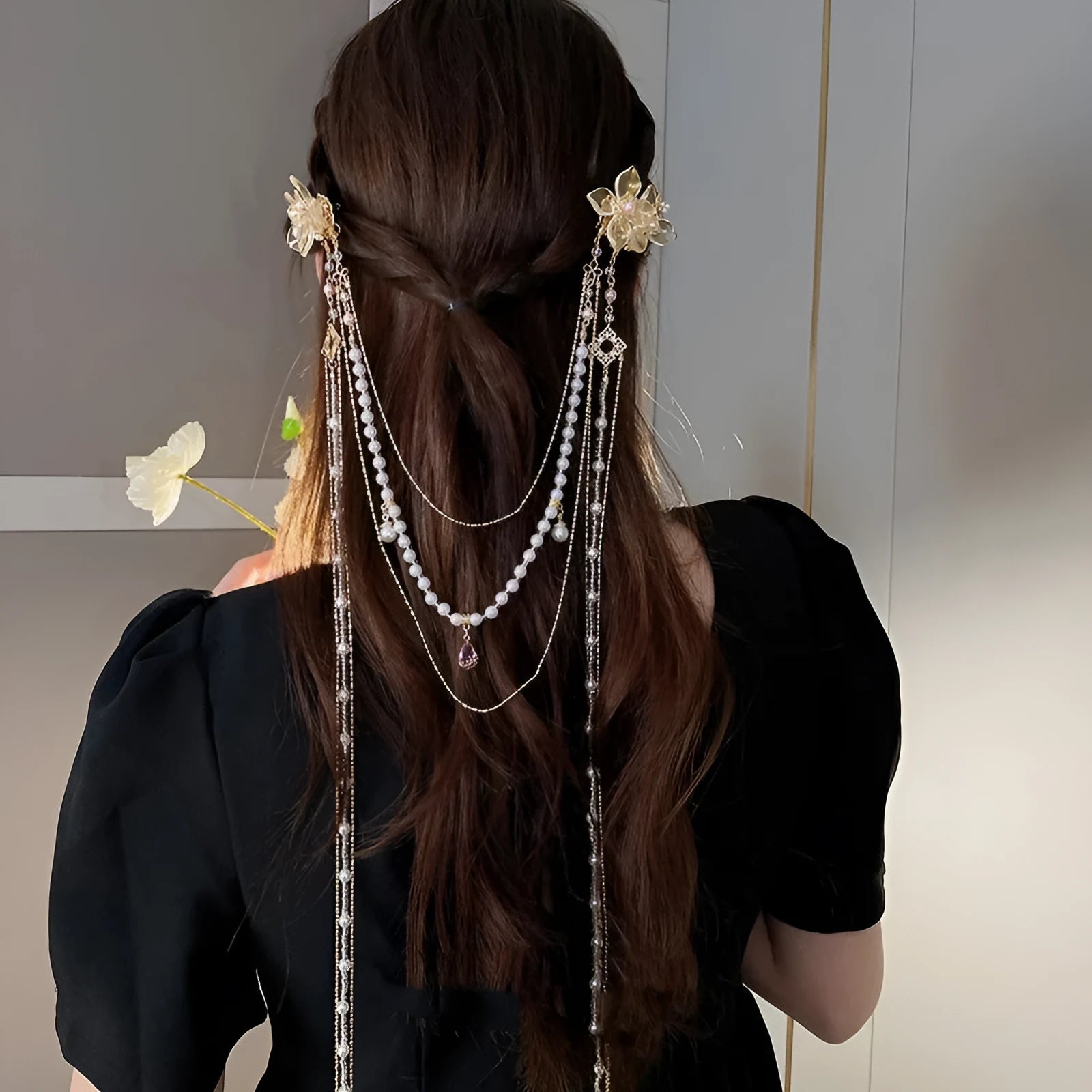 Gold grip acrylic hairpin with white pearl, clear diamond flower, and long beaded tassel decoration.