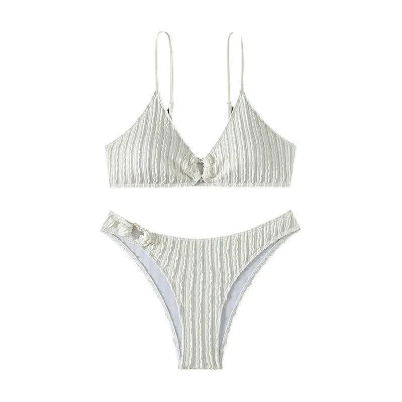 White women's V-neck sleeveless swimsuit top with matching shorts on a mannequin.