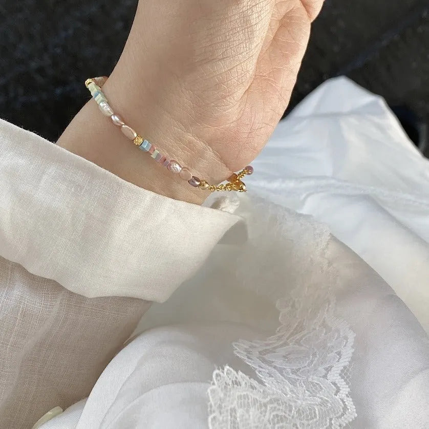 Women's 14K gilded purple silver bracelet with irregular natural pearls and matching necklace.