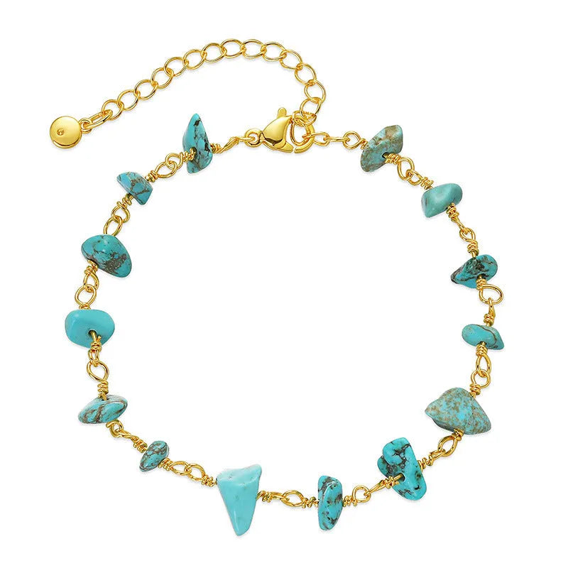 Geometric women's bracelet with irregular turquoise stones and crystal details on 18K copper