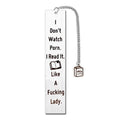 Stainless steel metal bookmark with a tassel, displayed next to its gift box.