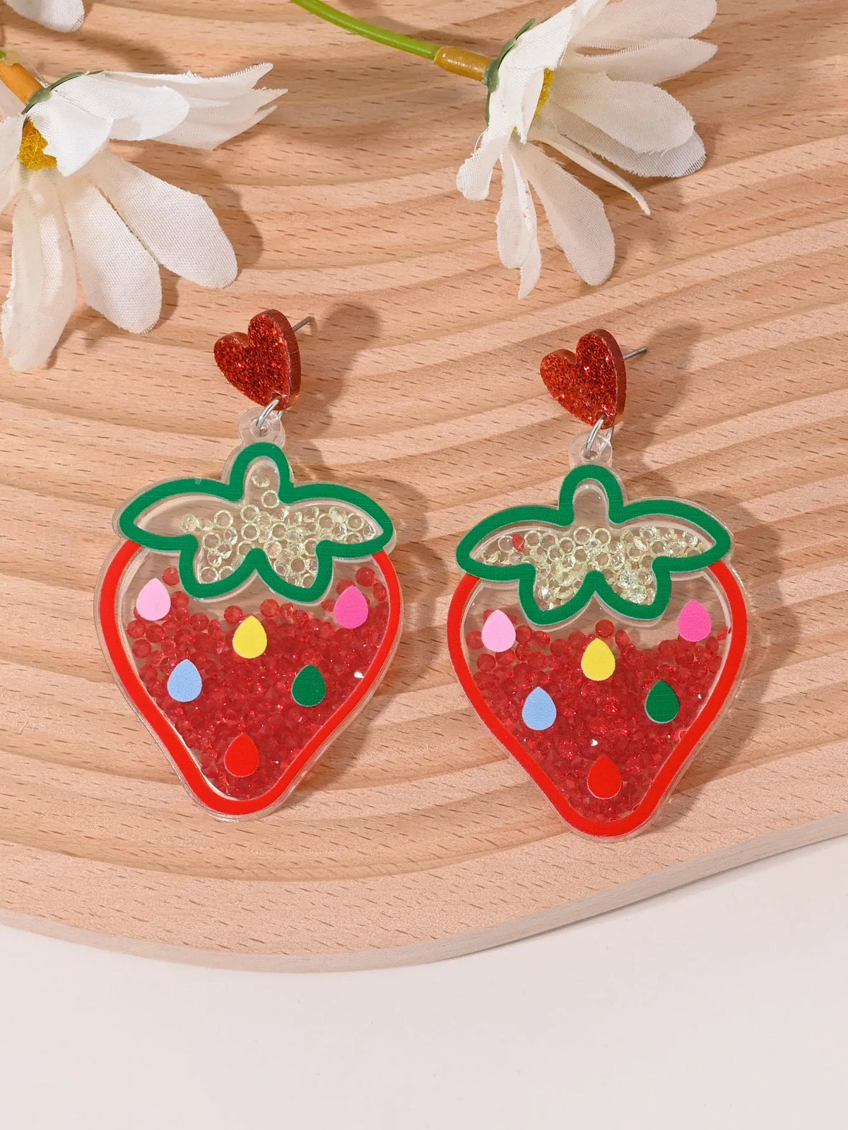 Colourful acrylic stud earrings with cherry, strawberry, watermelon, pineapple, coconut, cake, and ice cream designs.