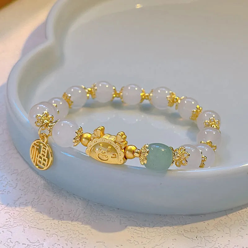 Women's glazed bracelet with floral ice crack pattern and zodiac animal modelling in electroplated finish