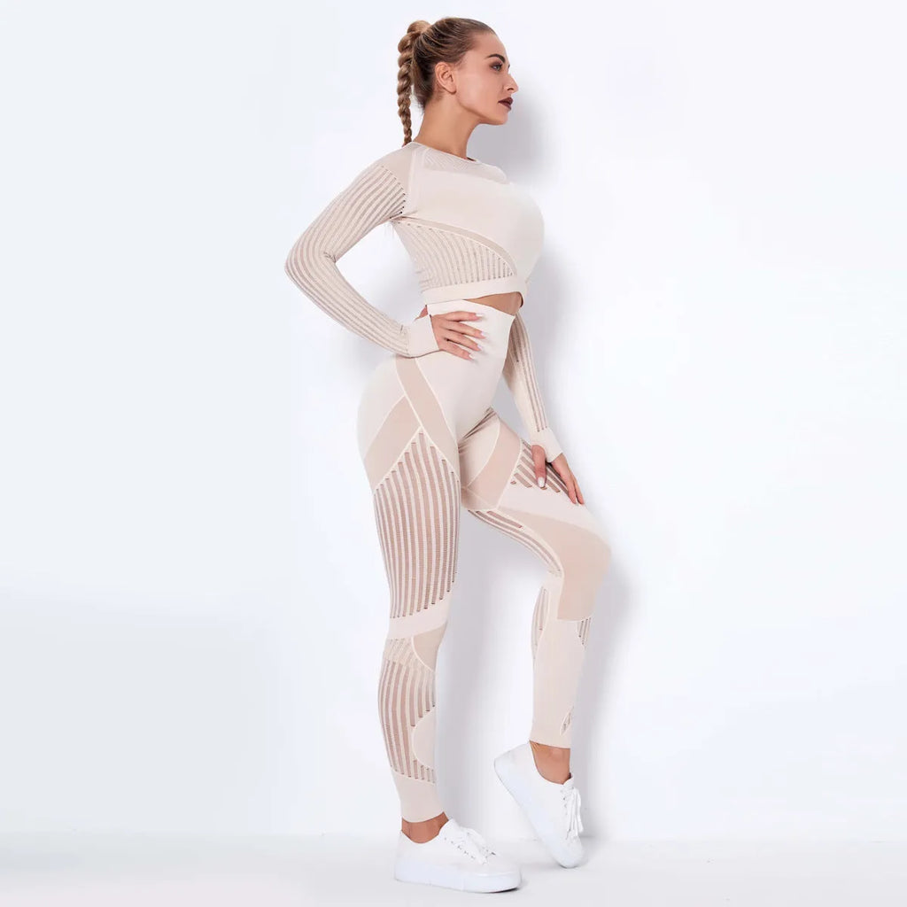 Woman wearing a seamless long-sleeved striped yoga suit in a stretch pose.