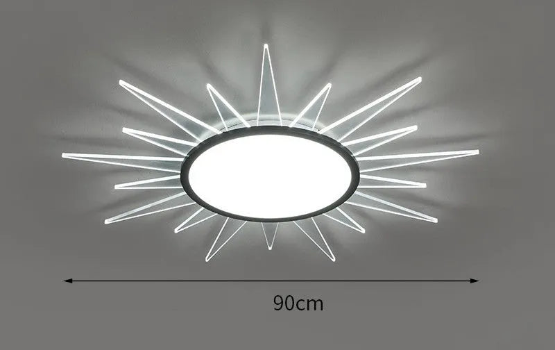 Modern round aluminium LED ceiling lamp with remote control for dimming and changing light colour.