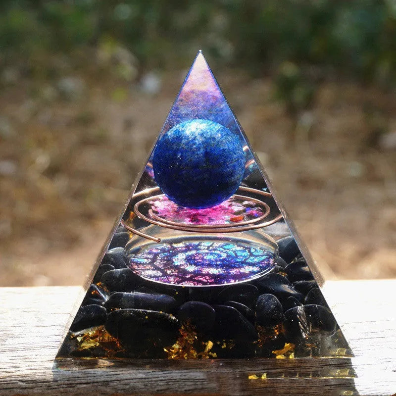 A clear 6cm tall epoxy resin pyramid hanging ornament for displaying crystals.
