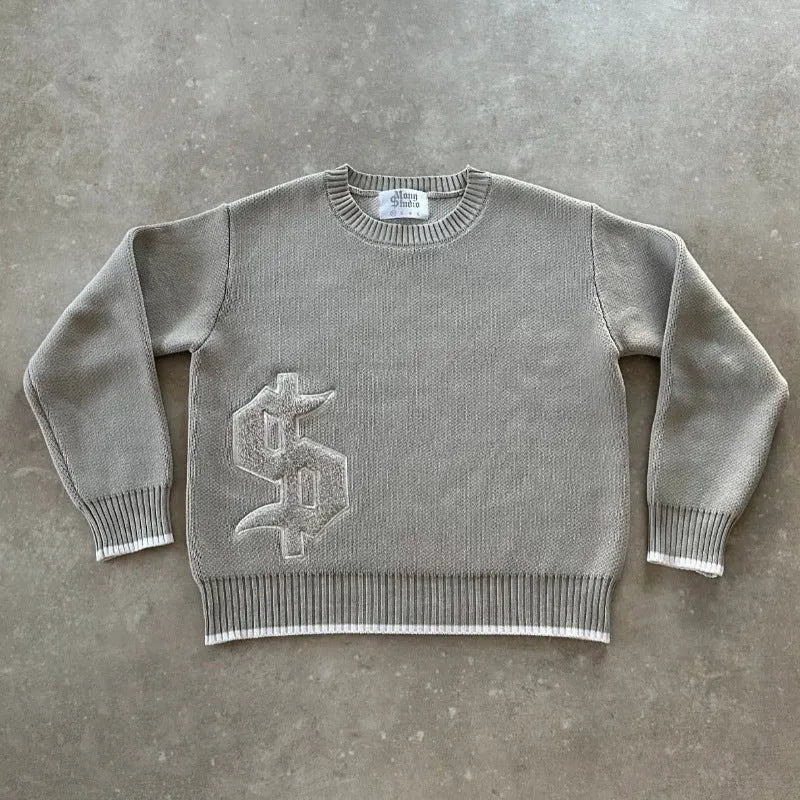 Grey loose-fitting long sleeve knitwear coat on a hanger.
