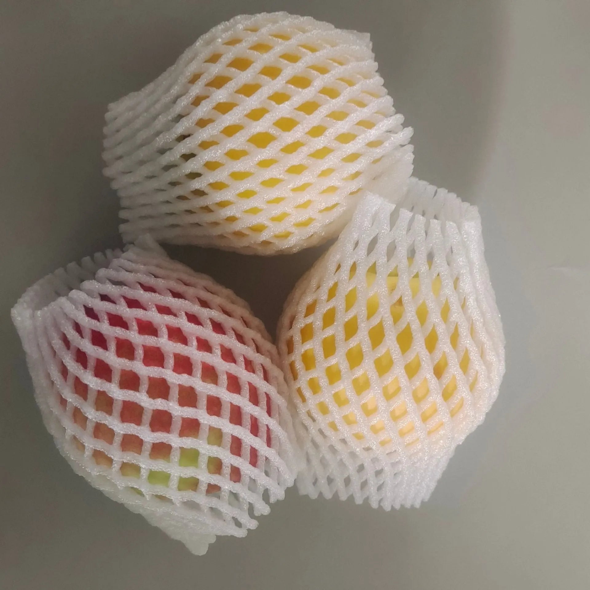 White foam fruit protective net cover shown in multiple size options for transport protection